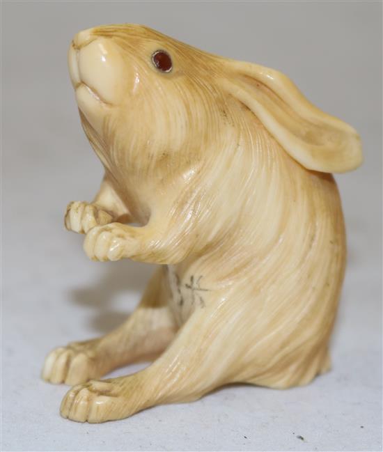 A Japanese ivory okimono of a hare, early 20th century, height 5.4cm, age cracks